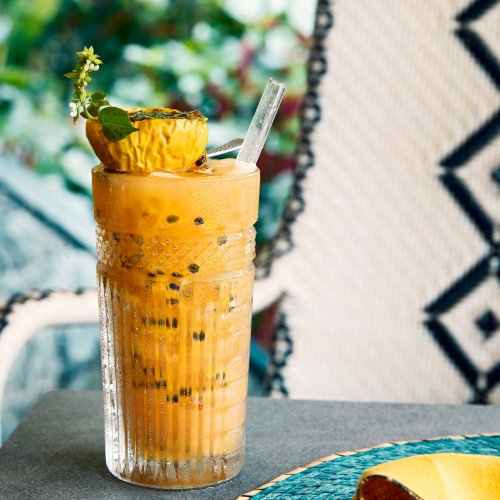 A delicious cocktail placed on a table in one of the hotels from the Príncipe Collection