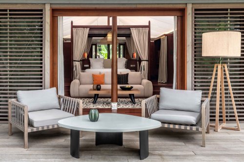 View of the terrace of a tent villa at Sundy Praia, with a focus on the large window into the bedroom.