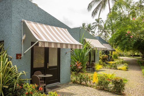 Bungalows surrounded by lush greenery on Príncipe Island