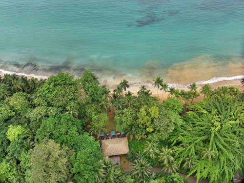 Aerial view of Bom Bom Beach Club on the shoreline of Príncipe Island