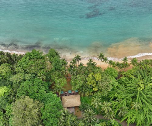 Aerial view of Bom Bom Beach Club on the shoreline of Príncipe Island