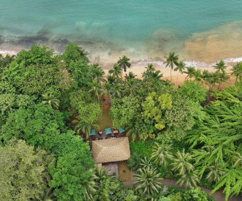 Aerial view of Bom Bom Beach Club on the shoreline of Príncipe Island