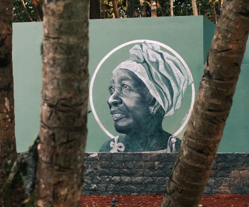 Carefully crafted painting of an elderly woman outside Bom Bom Beach Resort