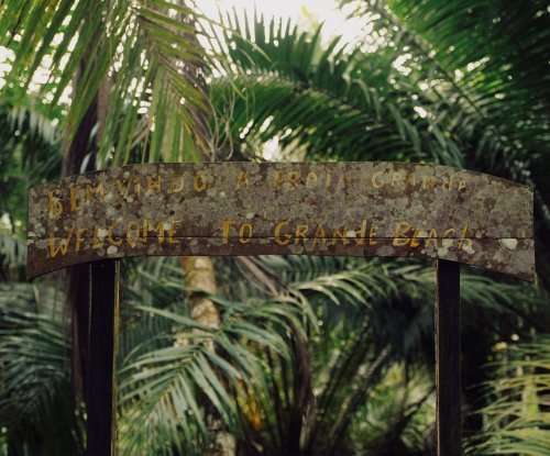 Signpost at the entrance of Grande Beach on Príncipe Island