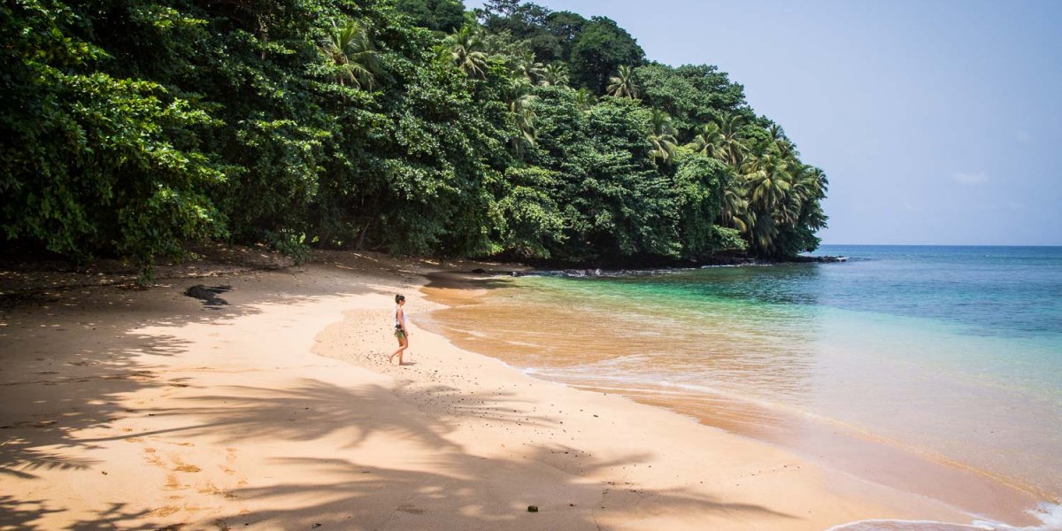 Person walking on the beach at Praia Boi on Príncipe Island